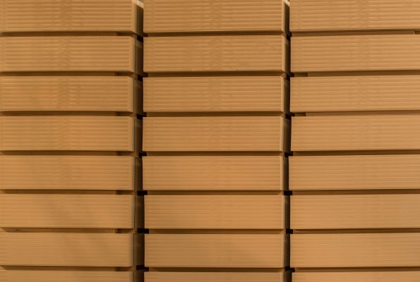 Pack of MDF laid in rows on the warehouse